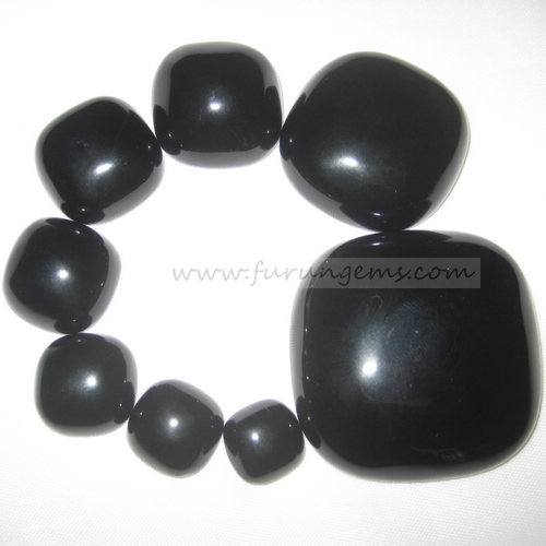 black agate cushion cabochons in various sizes